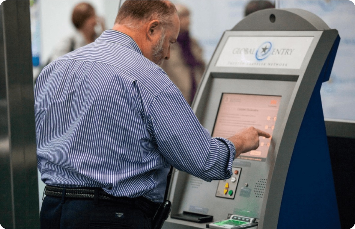 Traveler using a biometric self-service kiosk