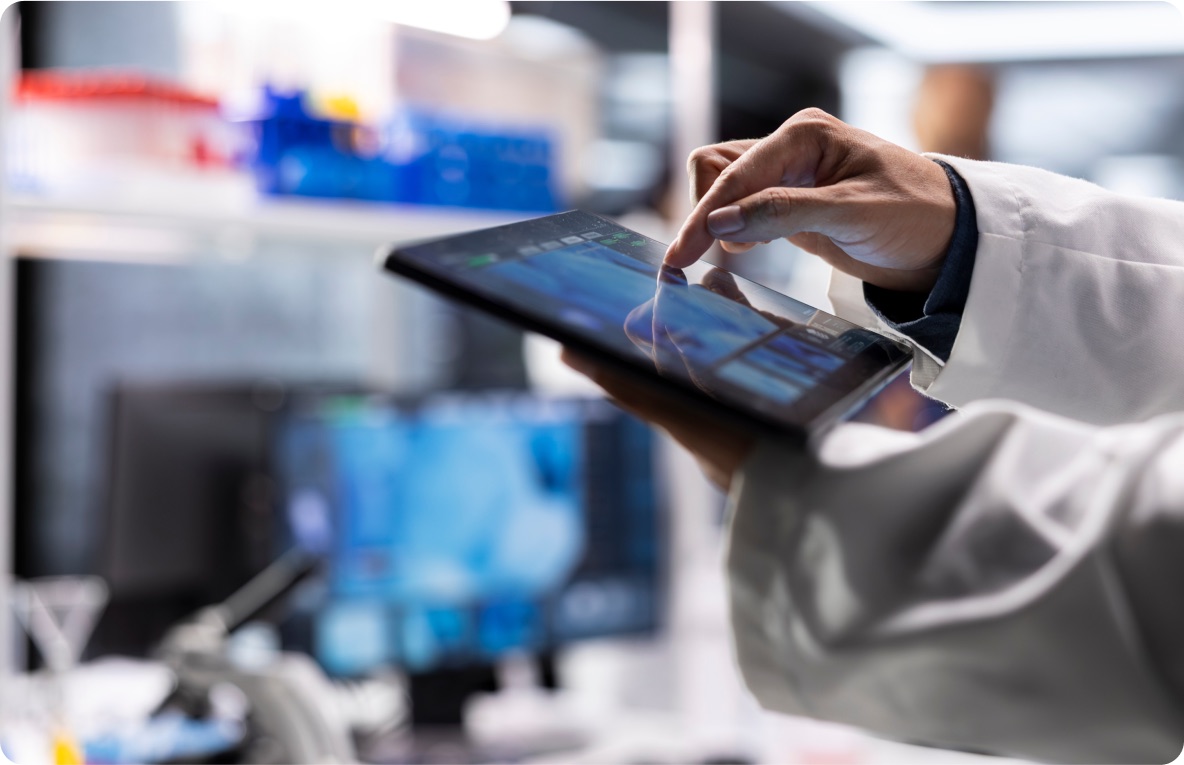 Clinician using a tablet in a lab